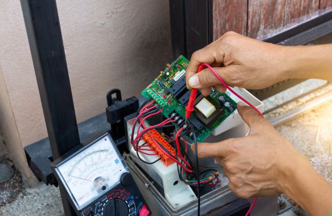 Automatic gate repairs using a multimeter on a gate control board – expert automatic gate servicing by Auto Gate Guys Melbourne Automatic gate repairs using a multimeter on a gate control board – expert automatic gate servicing by Auto Gate Guys Melbourne