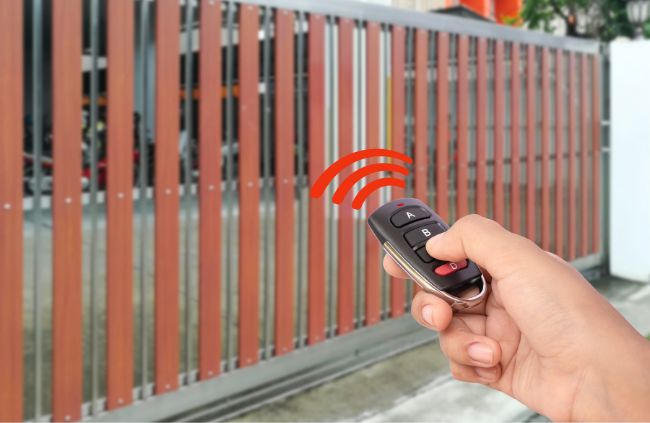 Wireless gate opener controlling a modern sliding gate installed by Auto Gate Guys Melbourne, offering convenience and security for Melbourne homes Wireless gate opener controlling a modern sliding gate installed by Auto Gate Guys Melbourne, offering convenience and security for Melbourne homes