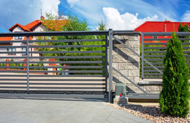 Modern electric sliding gate installed at a residential driveway by Auto Gate Guys Melbourne, designed for smooth automated access and secure entry. Modern electric sliding gate installed at a residential driveway by Auto Gate Guys Melbourne, designed for smooth automated access and secure entry.